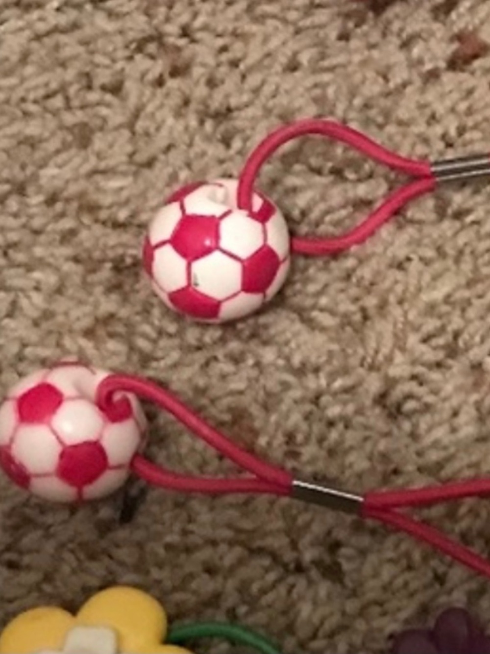 2 soccer ball hair ties